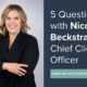 Nicole Beckstand stands next to "5 Questions" banner.